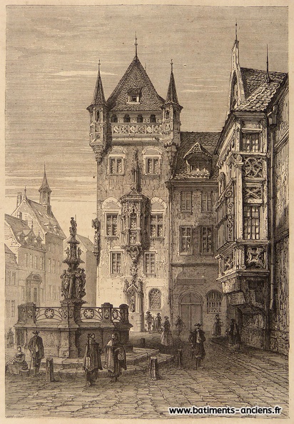 Vue d'un des bâtiments emblématiques de la ville de Nuremberg (Allemagne), la maison dite de Nassau , une habitation fortifié sous forme de tour. Construite à partir du XIIIe siècle dans le style roman, elle est ensuite agrémentée d'éléments gothiques tel le balcon et les tourelles en parties haute. Au premier plan, sur une place couverte d'un imposant dallage, la fontaine des vertus représente les vertus sous l'aspect de six femmes au dessus desquelles est figurée la justice. Sur les côtés on devine des maisons à colombage du Moyen-âge. P1280042.jpg